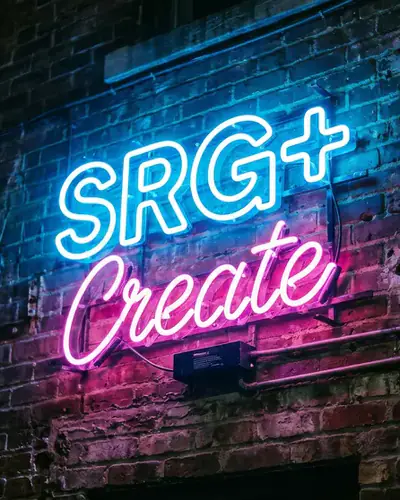 A neon sign that reads SRG+ Create